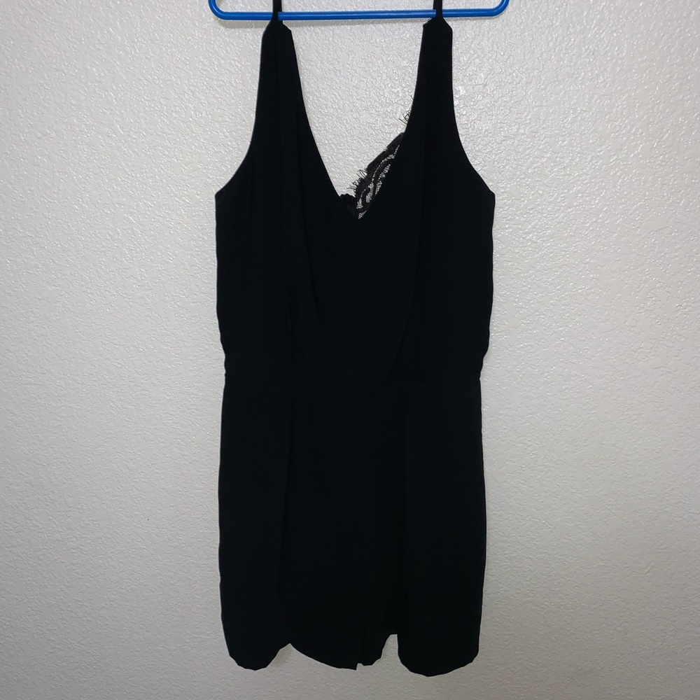 Black romper with a small amount of lace on back